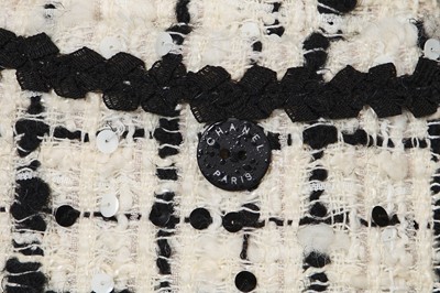 Lot 4 - A Chanel black and white bouclé tweed suit, Cruise collection 2003