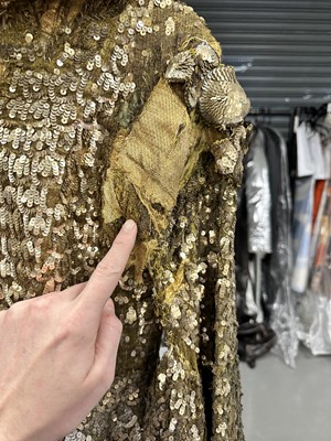 Lot 95 - An Erté sequined gold lamé coat, 1930s