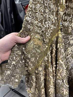 Lot 95 - An Erté sequined gold lamé coat, 1930s
