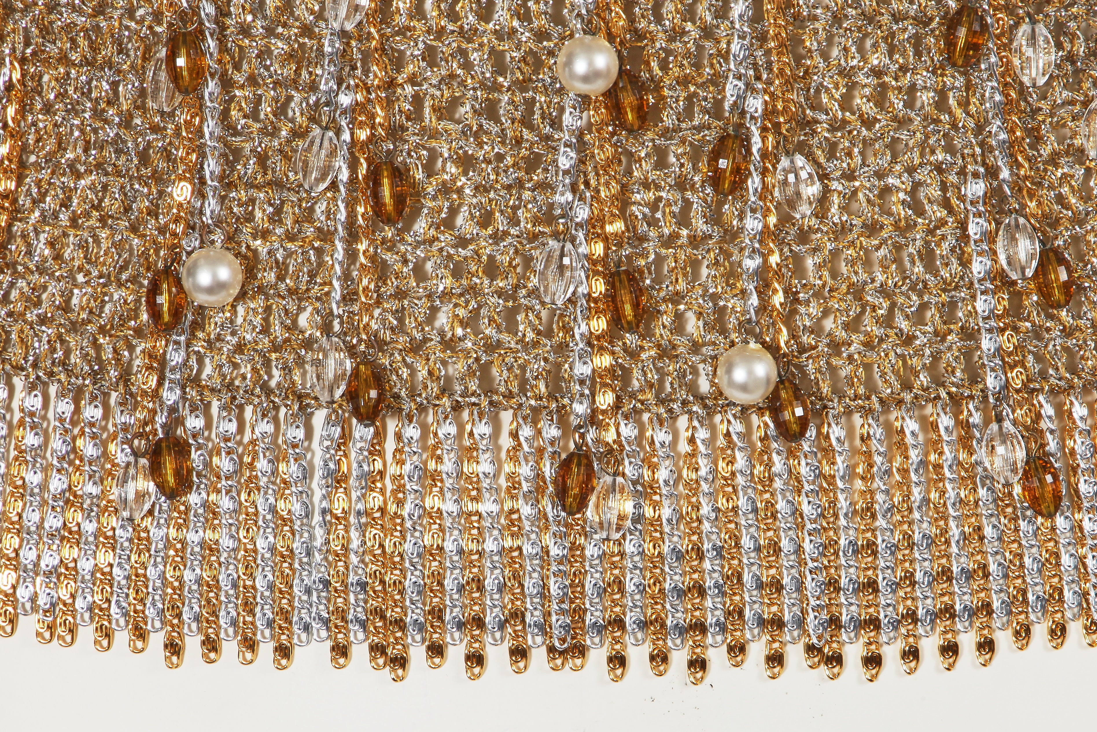Lot 514 - A Loris Azzaro beaded gold and silver lurex