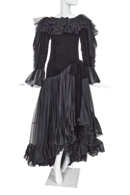 Lot 396 - An Yves Saint Laurent haute couture black velvet and tulle evening gown, circa 1980