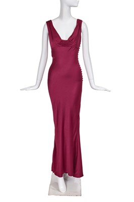 Lot 183 - A John Galliano burgundy bias-cut crêpe evening gown, commercial collection 2007