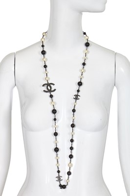 Lot 11 - A Chanel by Karl Lagerfeld black bead and faux pearl sautoir, Spring-Summer 2011
