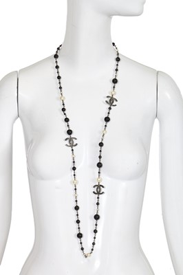 Lot 13 - A Chanel by Karl Lagerfeld black bead and faux pearl sautoir, Spring-Summer 2010