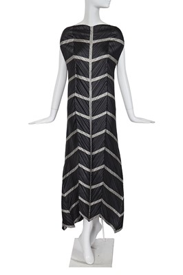 Lot 267 - An Issey Miyake black and silver pleated polyester dress, Autumn-Winter 1994-95
