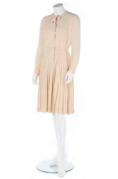 Lot 255 - A Chanel haute couture ivory silk crêpe dress,...