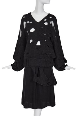 Lot 258 - An important early Comme des Garçons black knitted wool ensemble, 'Holes' collection, Autumn-Winter 1982-83