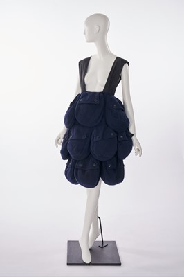 Lot 2 - An unusual cotton and polyester pocket pinafore skirt, probably 2000s