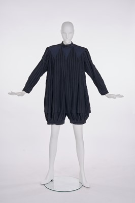 Lot 15 - An Issey Miyake frayed black and navy cotton playsuit, Autumn-Winter 1981-82