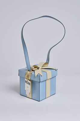 Lot 21 - A Moschino blue and ivory 'Gift' bag, circa 1996