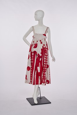 Lot 23 - A Stuart Memberey red and white printed cotton pinafore dress, 1990s