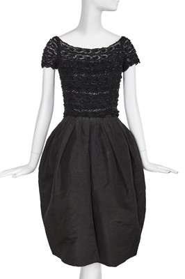 Lot 452 - A Christian Dior haute couture by Yves Saint Laurent black cocktail dress, '1960' line, Autumn-Winter 1959-60