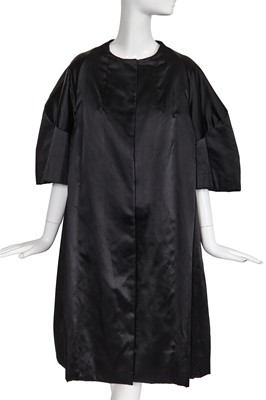 Lot 478 - A Jacques Heim black satin tent coat, mid 1950s