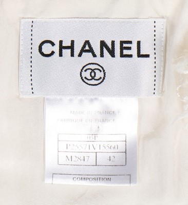 Lot 300 - A Chanel white tweed dress, 2005, labelled and...