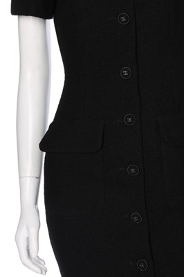 Lot 132 - A Chanel black bouclé wool dress and jacket...
