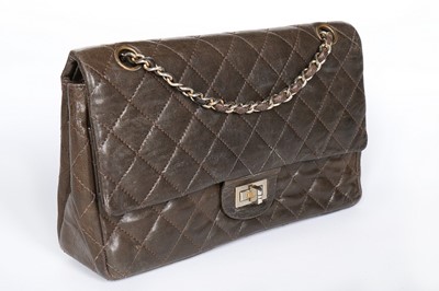 Lot 7 - A Chanel quilted brown leather flap bag, 1960s,...