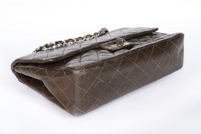 Lot 7 - A Chanel quilted brown leather flap bag, 1960s,...
