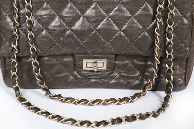 Lot 7 - A Chanel quilted brown leather flap bag, 1960s,...