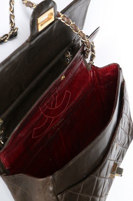 Lot 7 - A Chanel quilted brown leather flap bag, 1960s,...