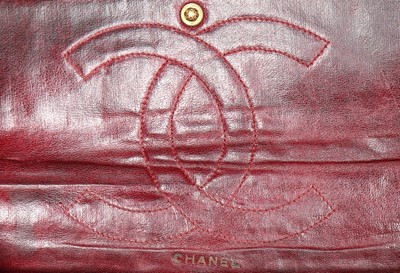 Lot 7 - A Chanel quilted brown leather flap bag, 1960s,...