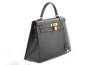 Lot 9 - An Hermès black Fjord leather Kelly bag, 1995,...