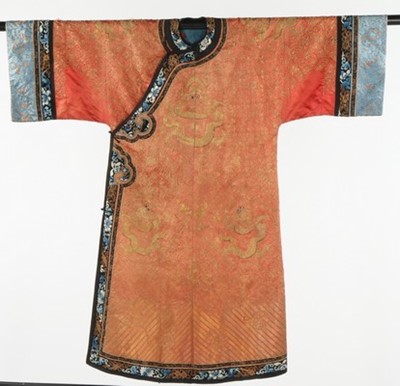 Lot 499 - An embroidered orange satin dragon robe, jifu,...