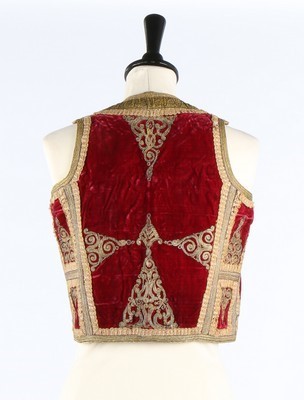 Lot 475 - An embroidered crimson velvet bolero waistcoat,...