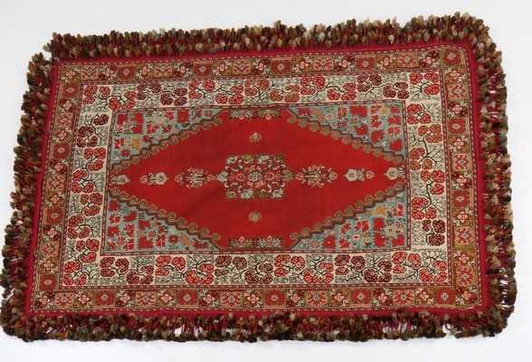 Lot 429 - An embroidered table carpet, dated by the...