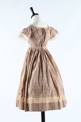 Lot 33 - Three printed cotton girl's dresses, one of...